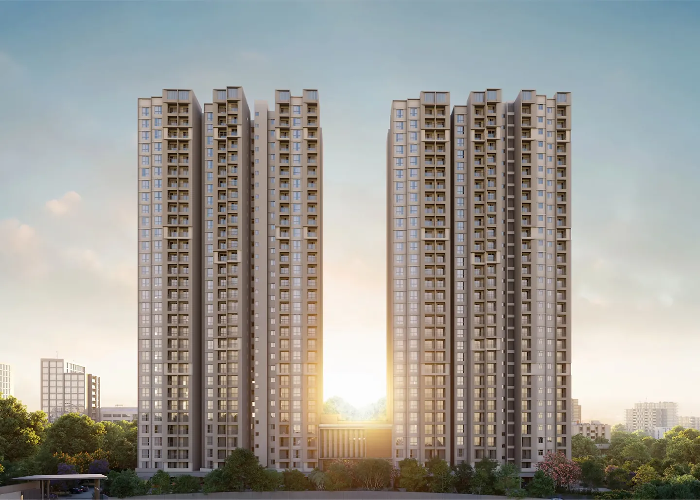 Orchid South Park by Goyal & Co., Electronic City, artistic impression Two groups of tall apartment towers against a sunset sky at Orchid South Park